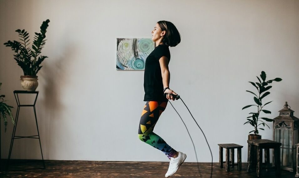 girl doing an exercise with a skipping rope. 