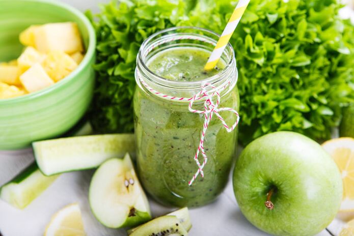 Hearty lunch detox smoothie with banana, apple, spinach, walnuts and flaxseed